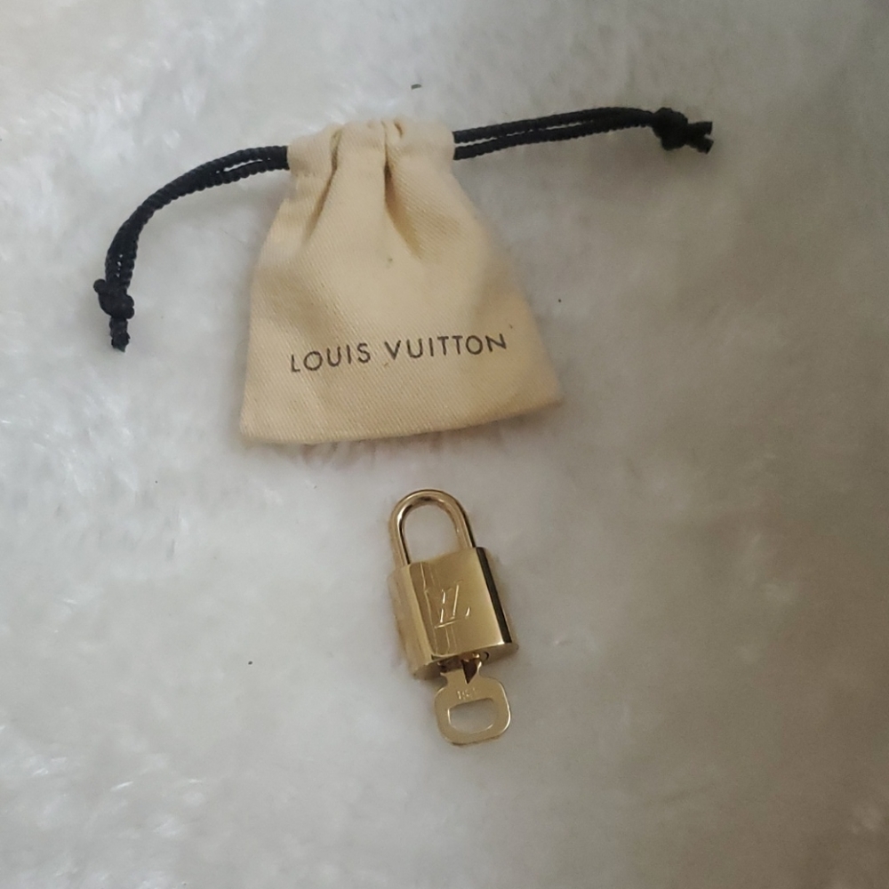 Louis Vuitton gold lock and key